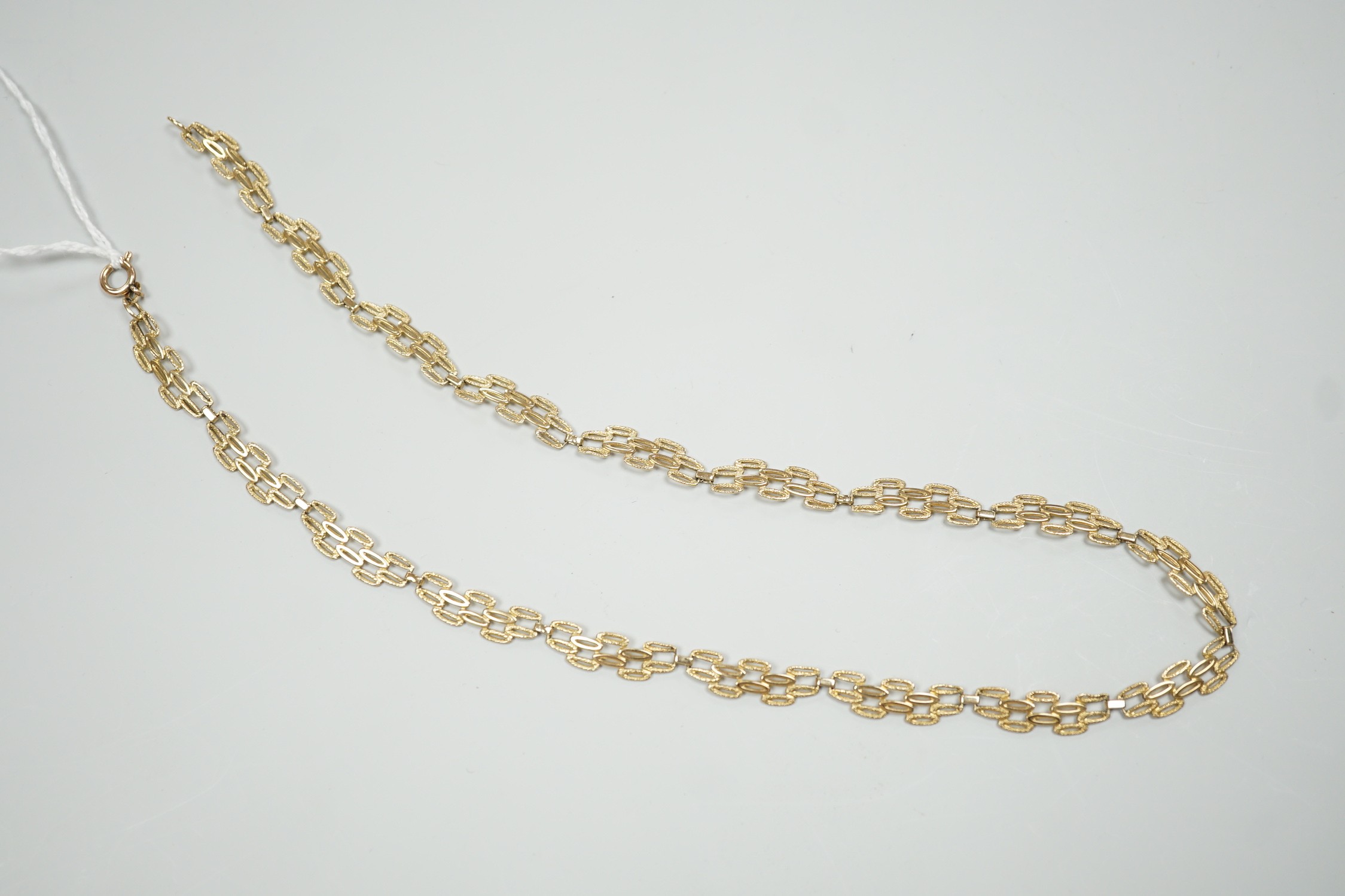 A 9ct gold pierced fancy link necklace, 45cm, 11 grams.